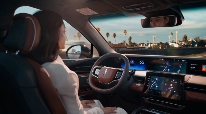 A person is shown driving hands-free on the highway with available Lincoln BlueCruise technology. | Gettel Lincoln in Punta Gorda FL