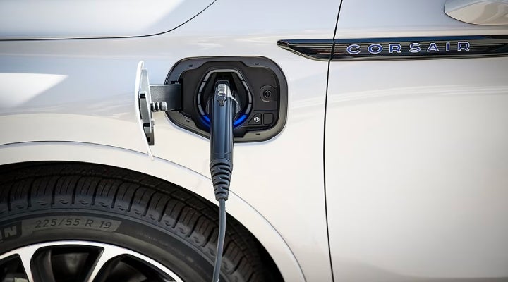 An electric charger is shown plugged into the charging port of a Lincoln Corsair® Grand Touring
model. | Gettel Lincoln in Punta Gorda FL