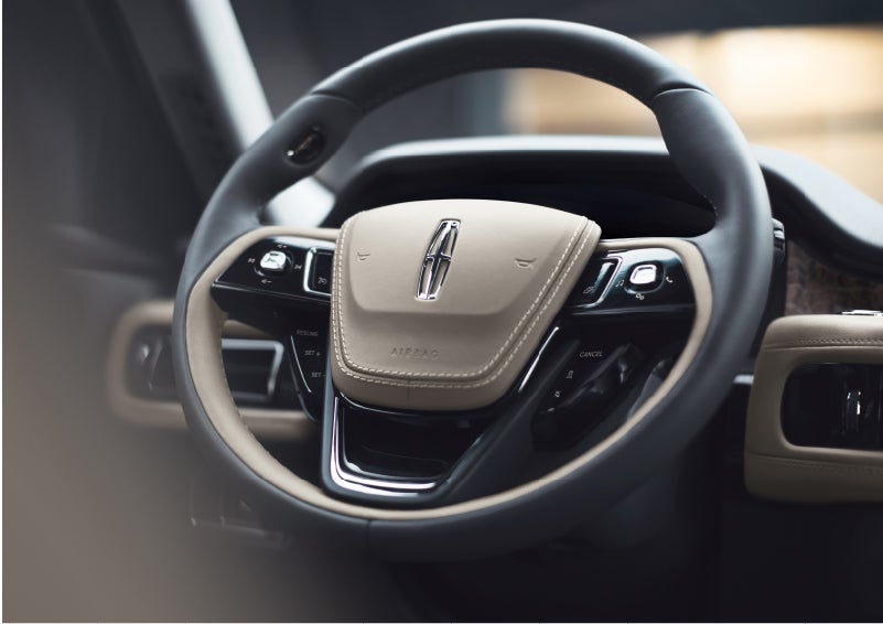 The intuitively placed controls of the steering wheel on a 2023 Lincoln Aviator® SUV | Gettel Lincoln in Punta Gorda FL