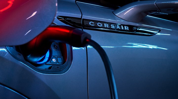 A charger plugged into the charging port of a 2024 Lincoln Corsair® Plug-in Hybrid model. | Gettel Lincoln in Punta Gorda FL
